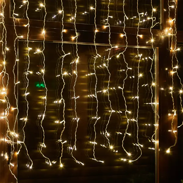 фото Гирлянда светодиодная занавес uniel электрическая 1.5x1.5 м теплый белый свет 8 режимов 100 ламп цвет прозрачный