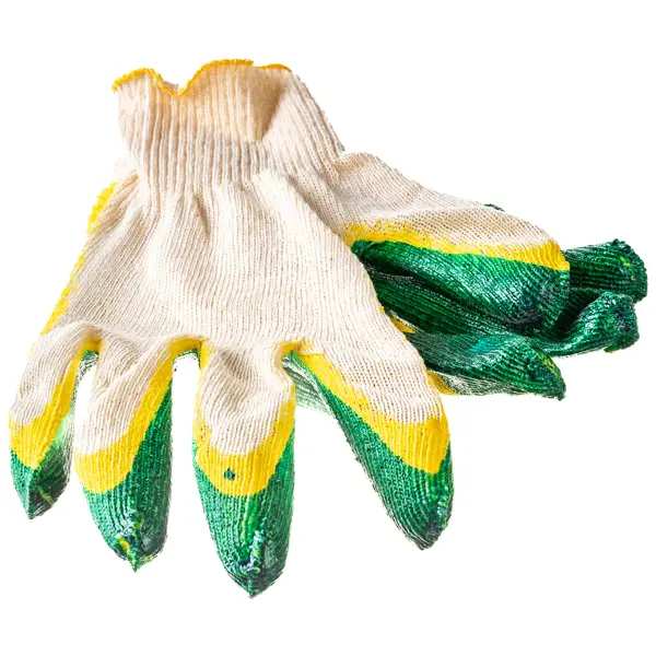 Старые грязные перчатки после использования на зеленом фоне.